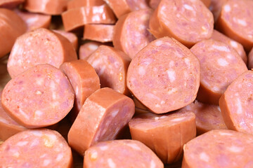 closeup of cut raw pepperoni sausages