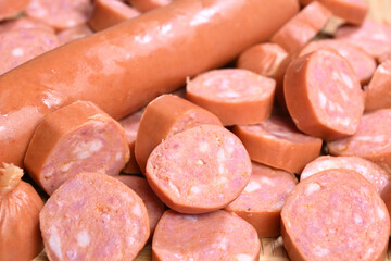 closeup of cut raw pepperoni sausages