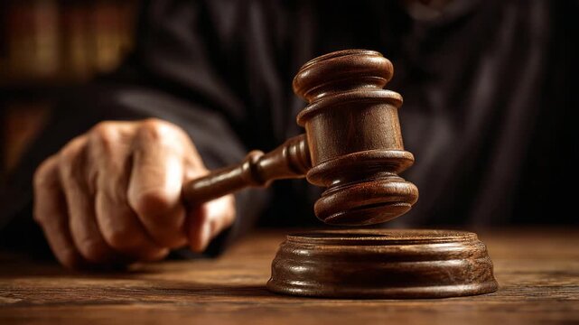 Ultra HD A Judges hand holding a gavel about to strike the sounding block, a judge hitting the gavel video