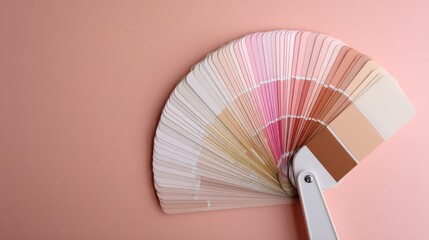 Paint swatch fan with soft neutral and pink tones on a pastel background