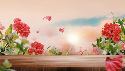 Empty wooden table top with blurred beautiful sunset and clouds background, surrounded by hibiscus flowers and other plants. Scenic summer evening banner with copy space.  © Riza