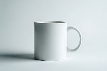 Obraz premium A plain white mug against a light gray background
