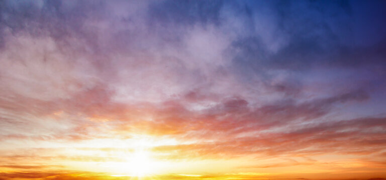 Sunset sky background. Panoramic view of sunset sky.