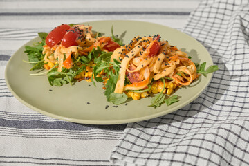 Single olive-colored plate with a beautifully served corn tortilla portion. Topped with caramelized onion, crab sticks, cherry tomatoes, arugula, and sesame, highlighting food aesthetics and taste.