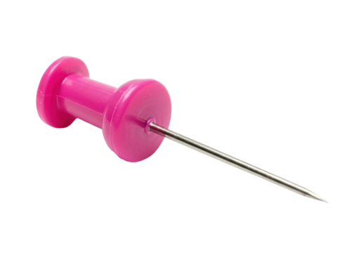 Isolated push pin on surface, pink plastic head and silver metal, sharp point ready