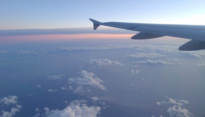 Obraz premium Airplane Wing View Clouds, Sky, Sunset, Aerial, Flight, Horizon, Travel, Altitude, Journey, Pastel