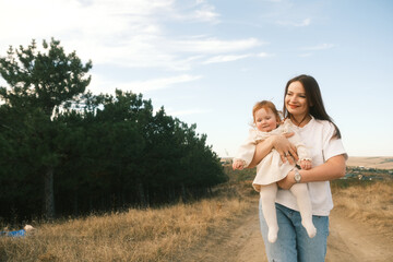 Obraz premium Joyful and Heartwarming Moments A Mother and Her Baby Relishing Time in Nature Together