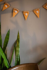 home decor for thanksgiving day. create art craft for children. American pumpkin pie - garland on wall. background