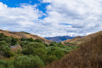 Scenic landmark with forest and blu cloudy sky, Armenia