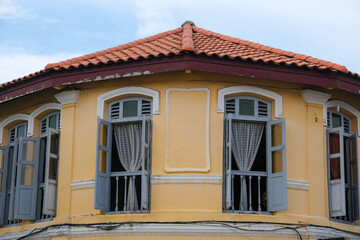 Colorful heritage colonial shophouse facade in George Town, Penang, Malaysia.