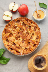 Delicious homemade apple pie with honey and coffee enjoyed during autumn season