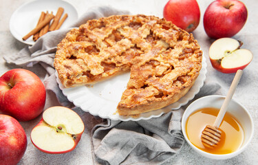 Fresh baked apple pie with cinnamon and honey