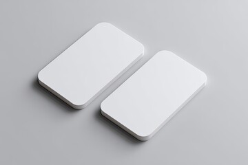 Two blank business cards on a light gray surface