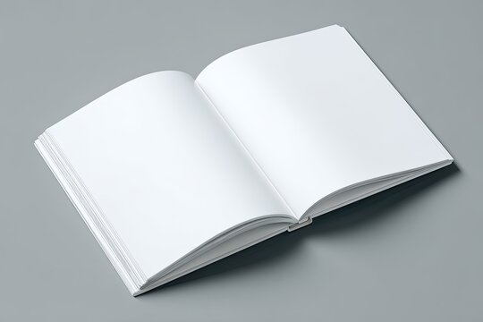 Open blank book on a gray surface