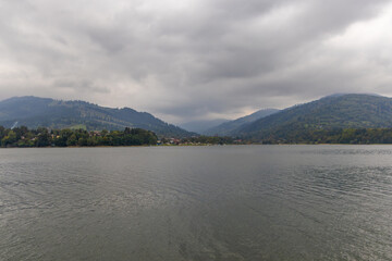 Landscape with a mountain lake on a cloudy day