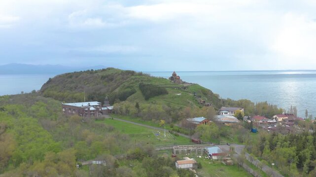 Aerial view of Sevanavank Monastery.
Scenic drone shot of a historic monastery on a hill by a large lake.