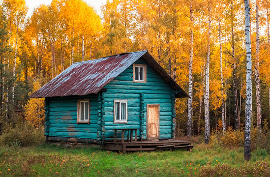 Rustic wooden cabin in vibrant autumn forest with yellow leaves
