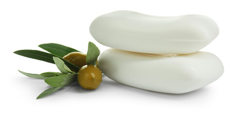 Natural soap bars, olives and green leaves isolated on white