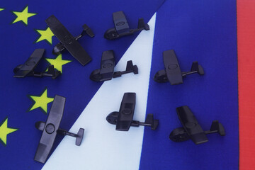 Many military drone with Russian and European Union flags. Concept of Russian drones in EU.