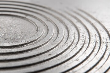 Close-up of concentric circles on a metallic surface