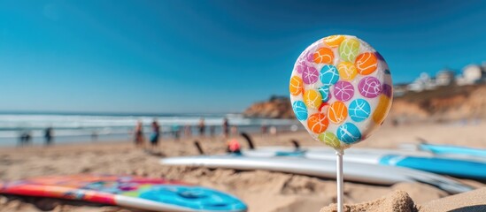Colorful lollipop on a beach with surfboards