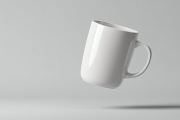 Obraz premium White mug in mid-air against a gray background
