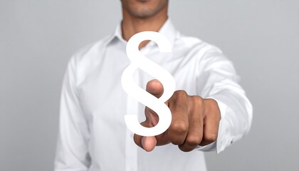 Person in white shirt pointing at a paragraph symbol