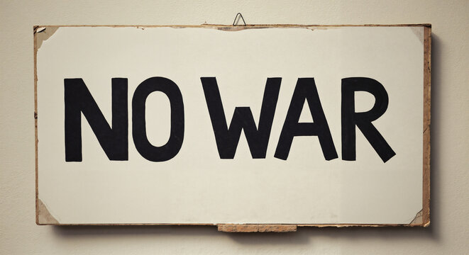 Protest sign displaying the message 'No War' on a wall  