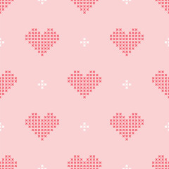Pink and white cross-stitch hearts making a cute seamless pattern for love concepts