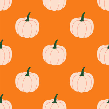 White pumpkins in seamless autumn pattern on orange background