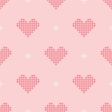Pink and white cross-stitch hearts making a cute seamless pattern for love concepts