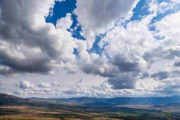 Amazing landmark with settlements and mountains and cloudy sky at Armenia-Georgia state border