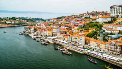 Fototapeta premium Porto, Portugal - July 10 2025: The picturesque landscape of river shore of Douro River in Portugal