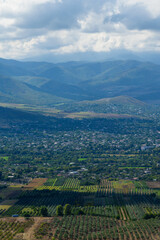 Obraz premium Amazing landmark with settlements and mountains and cloudy sky at Armenia-Georgia state border