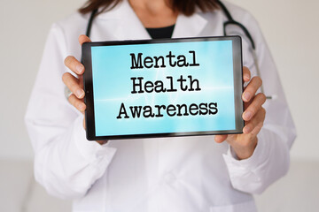 medical concepts. mental health awareness. words written on a female doctor's tablet
