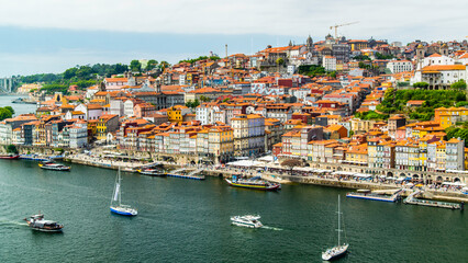 Fototapeta premium Porto, Portugal - July 10 2025: The picturesque landscape of river shore of Douro River in Portugal