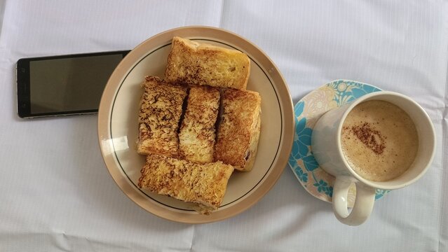 Toasted Bread with Hot Coffee typical Indonesian food - Powered by Adobe
