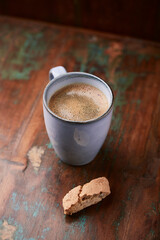 Cup of coffee on rustic wooden background. Soft focus. Copy space	