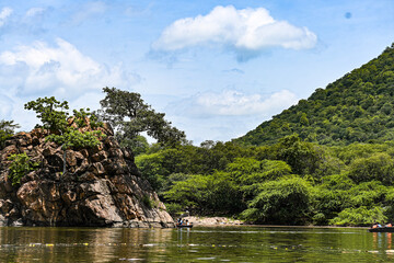 Scenic Mountain Landscape with Green Hills and River Under Blue Sky