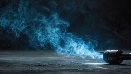 Dark studio shot of blue smoke