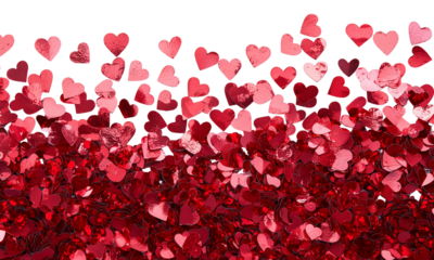 Scattered red and pink heart confetti forming a dense lower layer and a drifting upper shower against a black background, evoking romance and celebration.