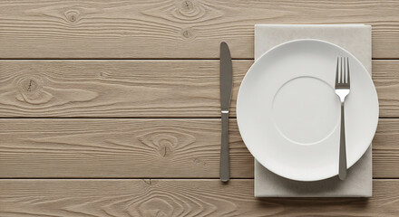 Overhead view of a white plate with a fork on a rustic wooden table setting