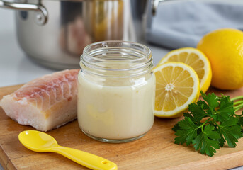Homemade baby puree with cod fish in glass jar