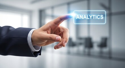 Hand touching analytics button on a screen in a blurred office environment in a business setting