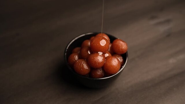 Gulab Jamun, A beloved dessert in Indian and Pakistani cuisine, drenched in sweet syrup