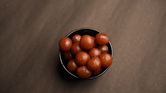Gulab Jamun, A beloved dessert in Indian and Pakistani cuisine, drenched in sweet syrup