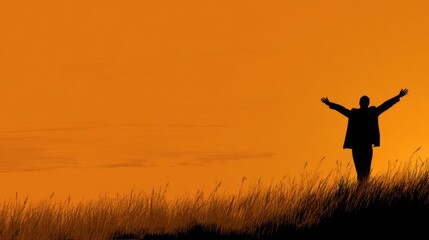 Person Enjoying a Sunset on a Grassy Hill, Arms Raised in Celebration, Silhouetted Against a Warm Orange Sky