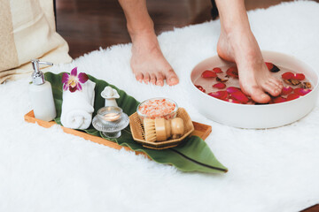 Man indulges in blissful foot massage at luxurious spa salon while masseur give reflexology therapy in gentle day light ambiance resort or hotel foot spa. Quiescent