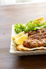 Close-up of traditional Turkish shish kebabs on oval plate