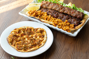 Close-up of traditional Turkish shish kebabs on oval plate